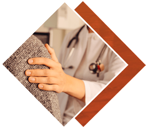 Medical staff's hand on person's shoulder
